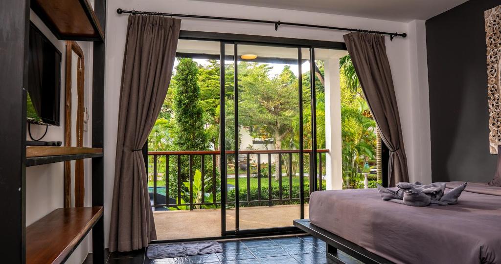 Postel nebo postele na pokoji v ubytování Aqua Suites