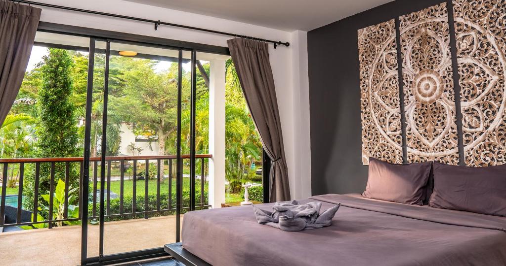 Postel nebo postele na pokoji v ubytování Aqua Suites