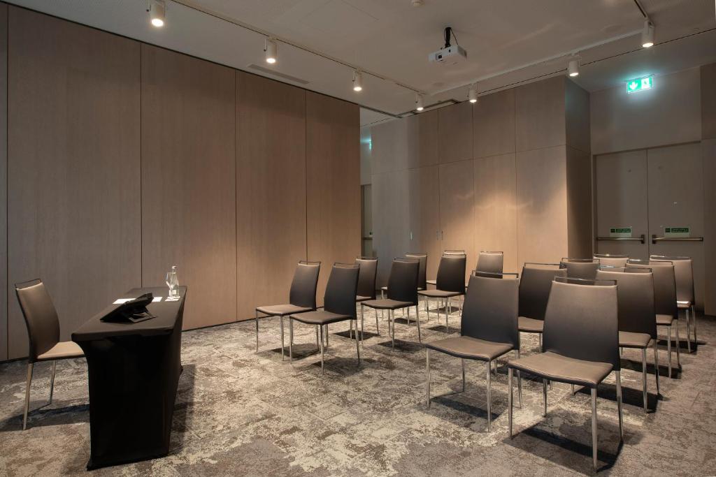 A compact conference room set in a classroom-style arrangement.