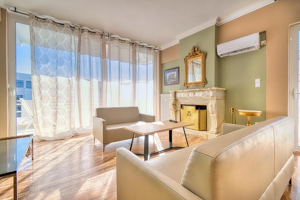 a living room with a couch and a fireplace at Elegant flat Marousi District in Athens