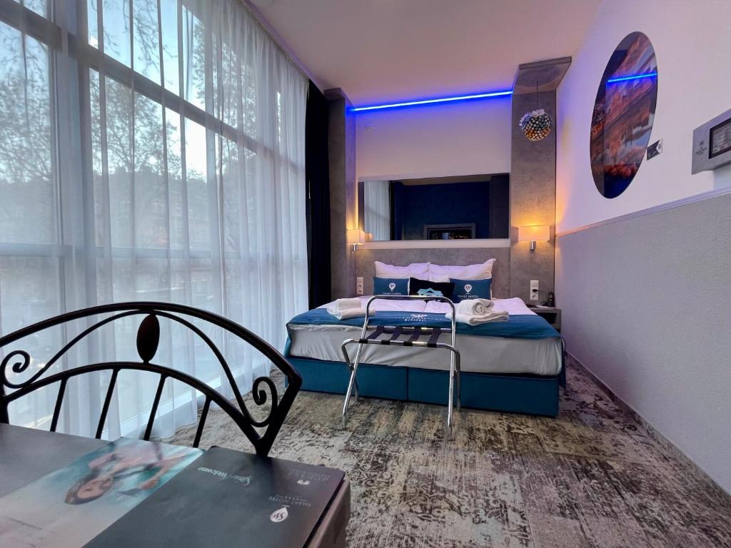 Postel nebo postele na pokoji v ubytování Smart Hotel Budapest