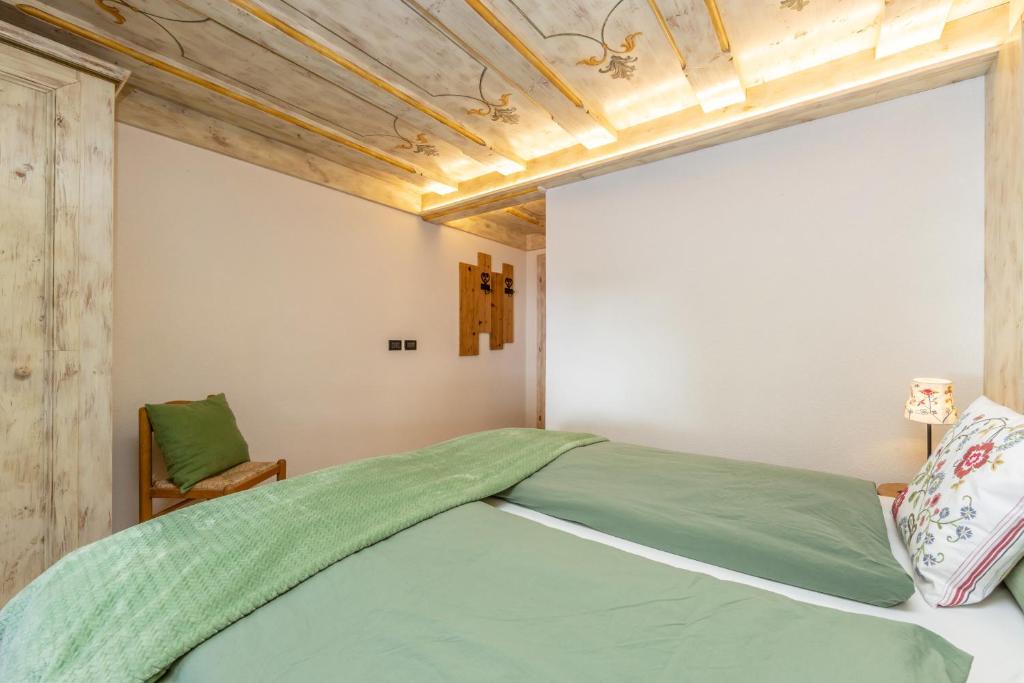 Postel nebo postele na pokoji v ubytování Rifugio Cereda