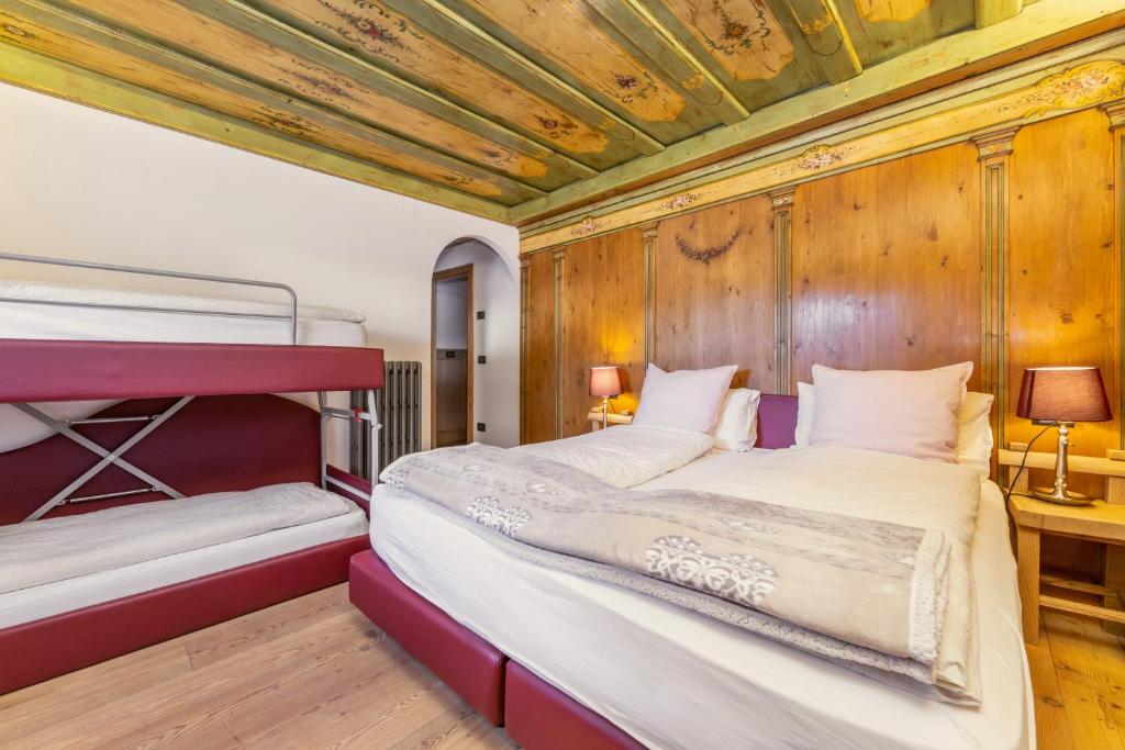 Postel nebo postele na pokoji v ubytování Rifugio Cereda