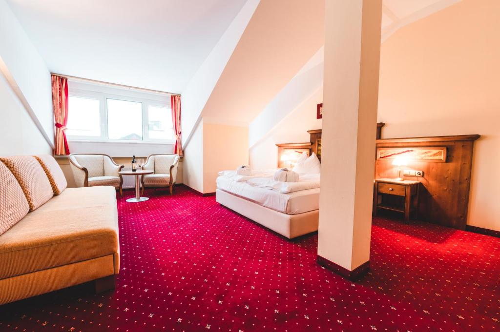 A bed or beds in a room at Appartements Cella Central