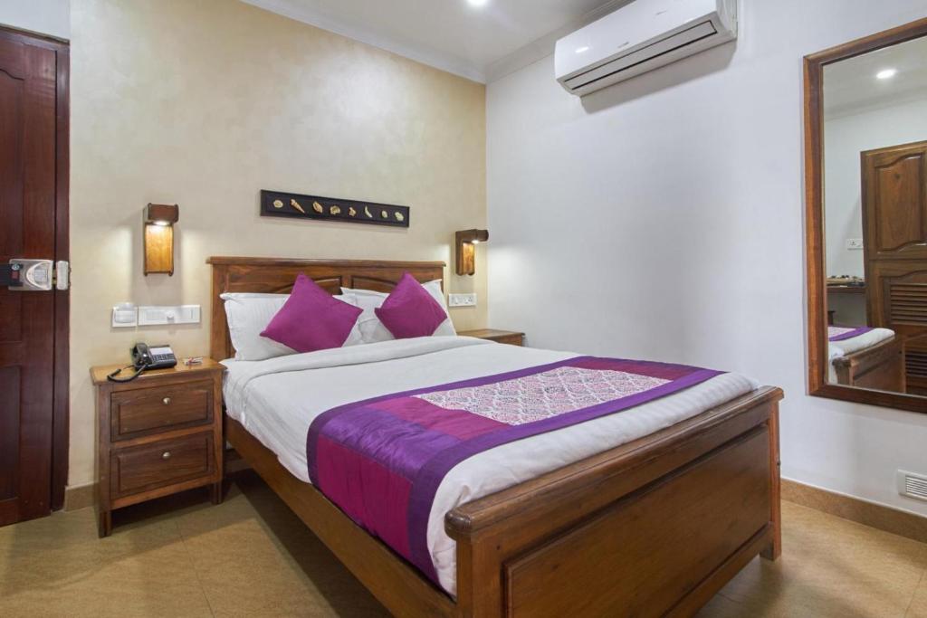 Postel nebo postele na pokoji v ubytování Hotel Mart View