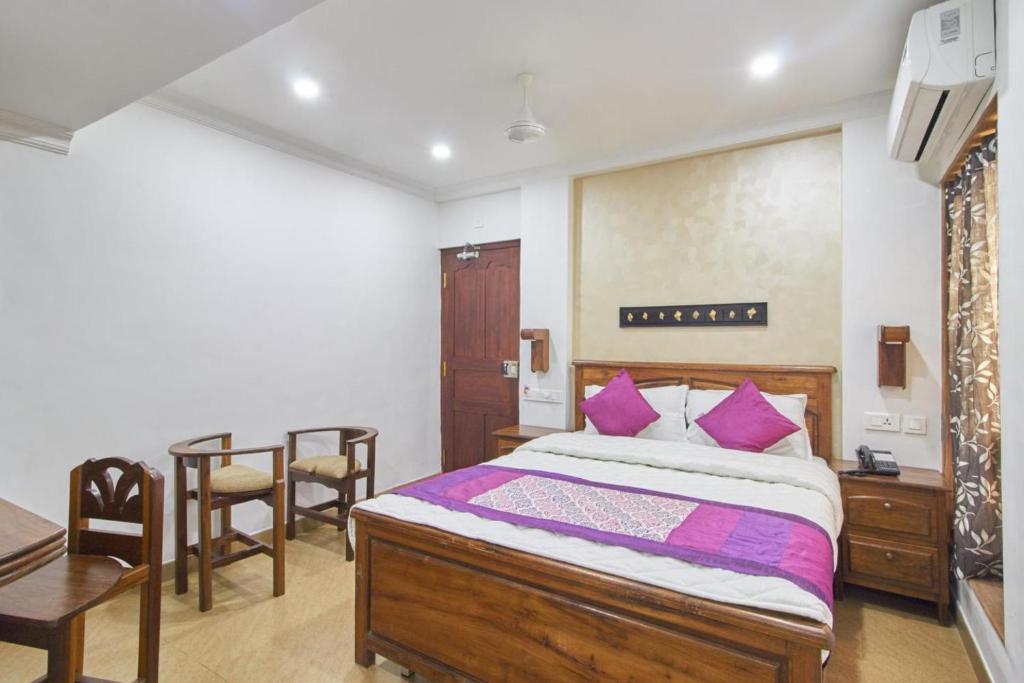 Postel nebo postele na pokoji v ubytování Hotel Mart View