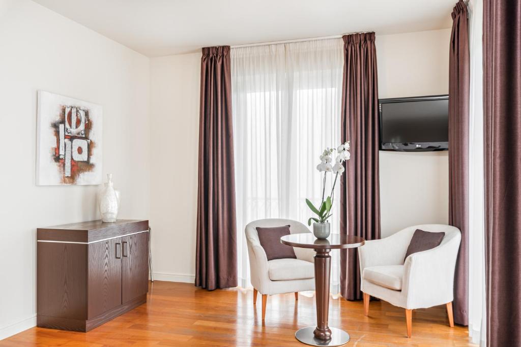 TV a/nebo společenská místnost v ubytování Hotel & Residence Exclusive