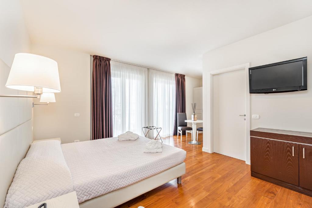Postel nebo postele na pokoji v ubytování Hotel & Residence Exclusive