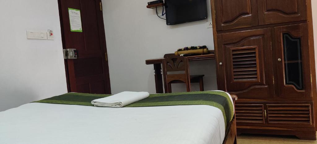 Postel nebo postele na pokoji v ubytování Hotel Mart View