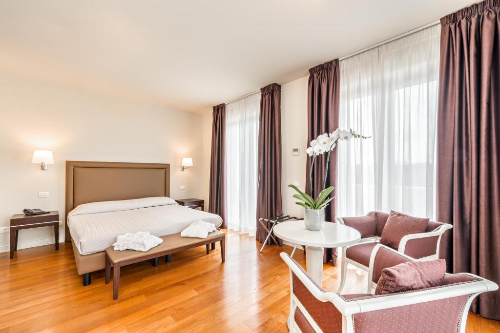 Postel nebo postele na pokoji v ubytování Hotel & Residence Exclusive