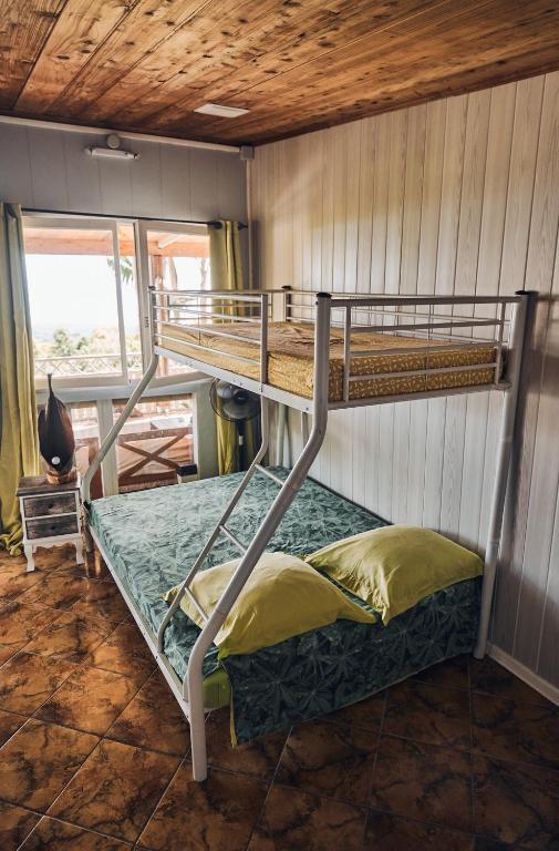 Postel nebo postele na pokoji v ubytování La Kaz Fleur Vanille