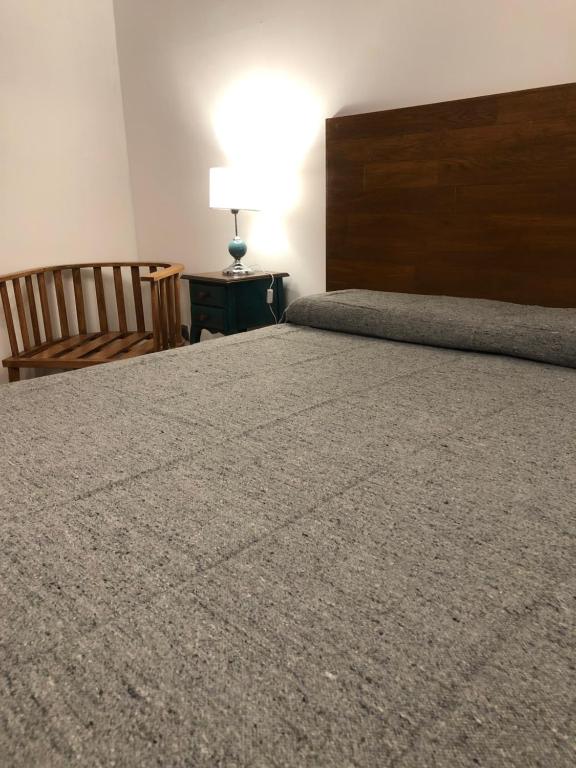 Un pat sau paturi într-o cameră la Petit Deluxe Salta