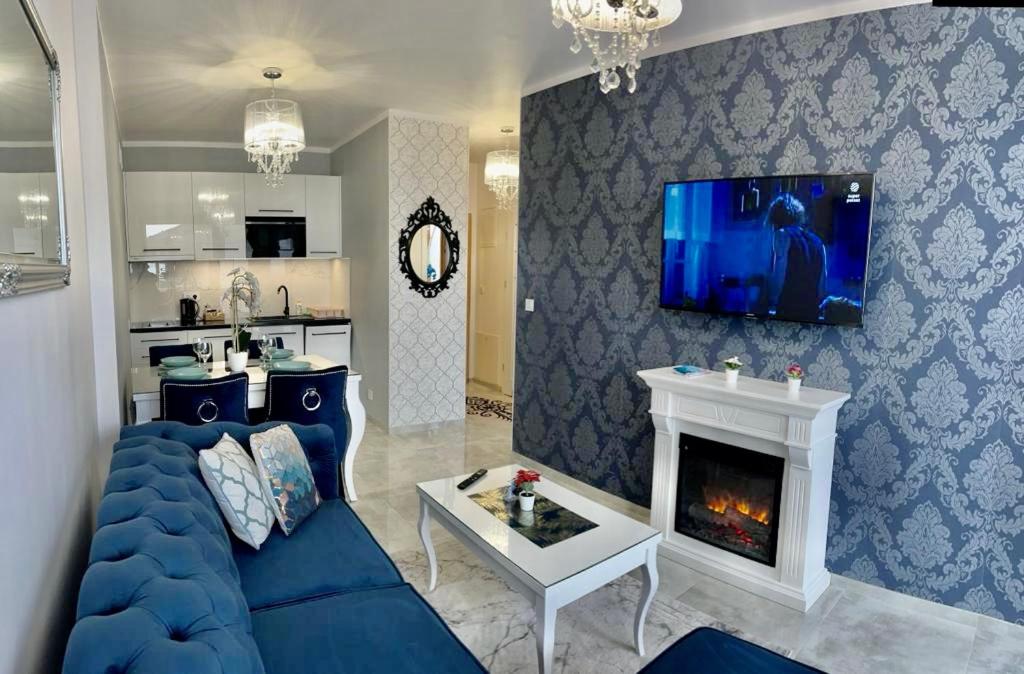 Televízia a/alebo spoločenská miestnosť v ubytovaní Apartament Rysy ApartamentyZakopianskie Basen Sauna Jacuzzi