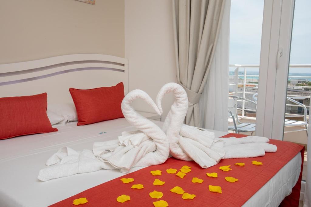 En eller flere senge i et værelse på Hotel Perla Dello Ionio
