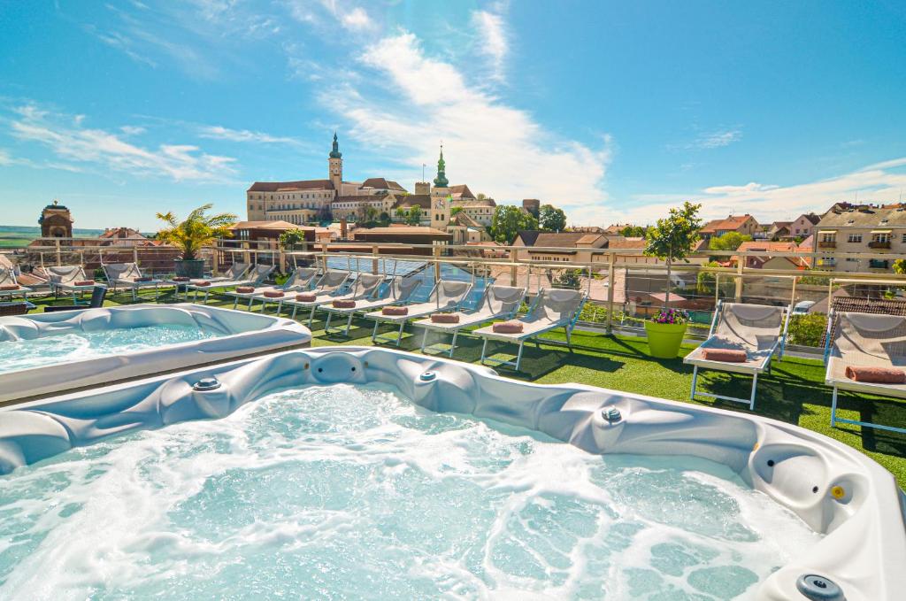 a hot tub on the roof of a resort at Hotel Galant Mikulov in Mikulov