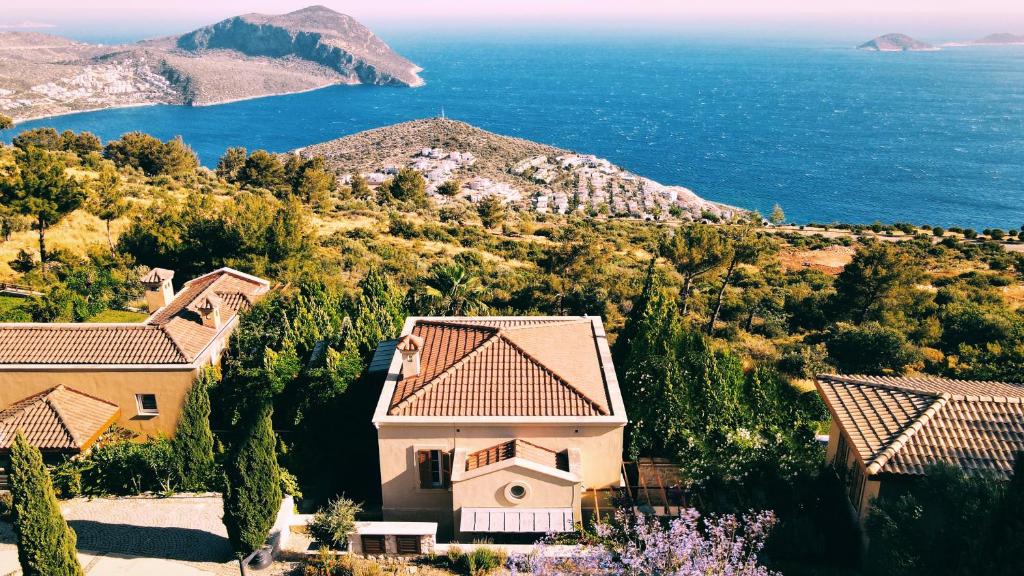 an aerial view of a house and the ocean at Villa Marlin in Kalkan
