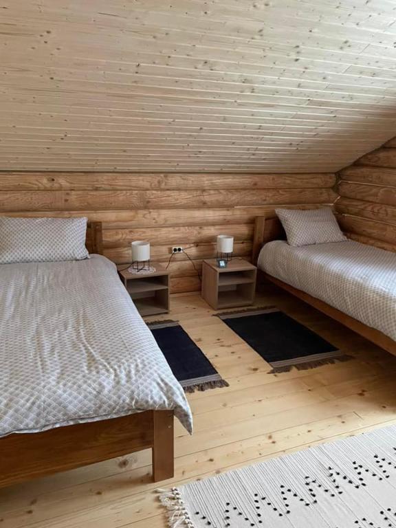 Postel nebo postele na pokoji v ubytování Котедж Gasthof Dresden