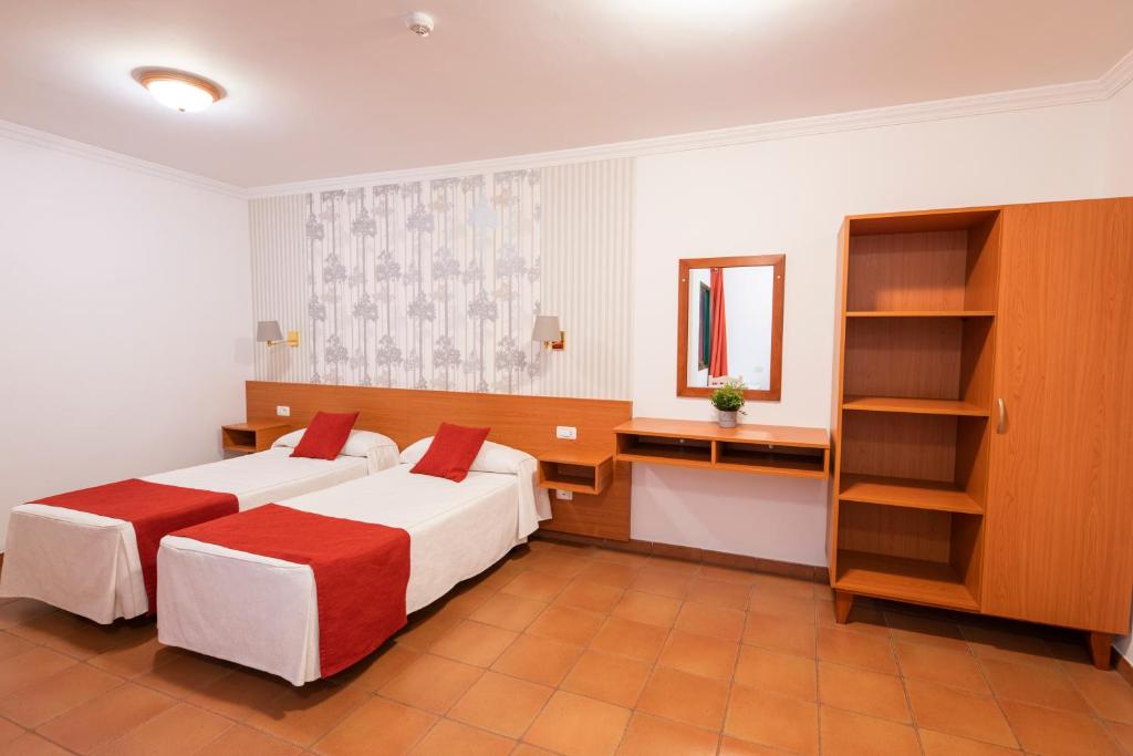 Postel nebo postele na pokoji v ubytování Hotel Apartamentos Villa Gomera