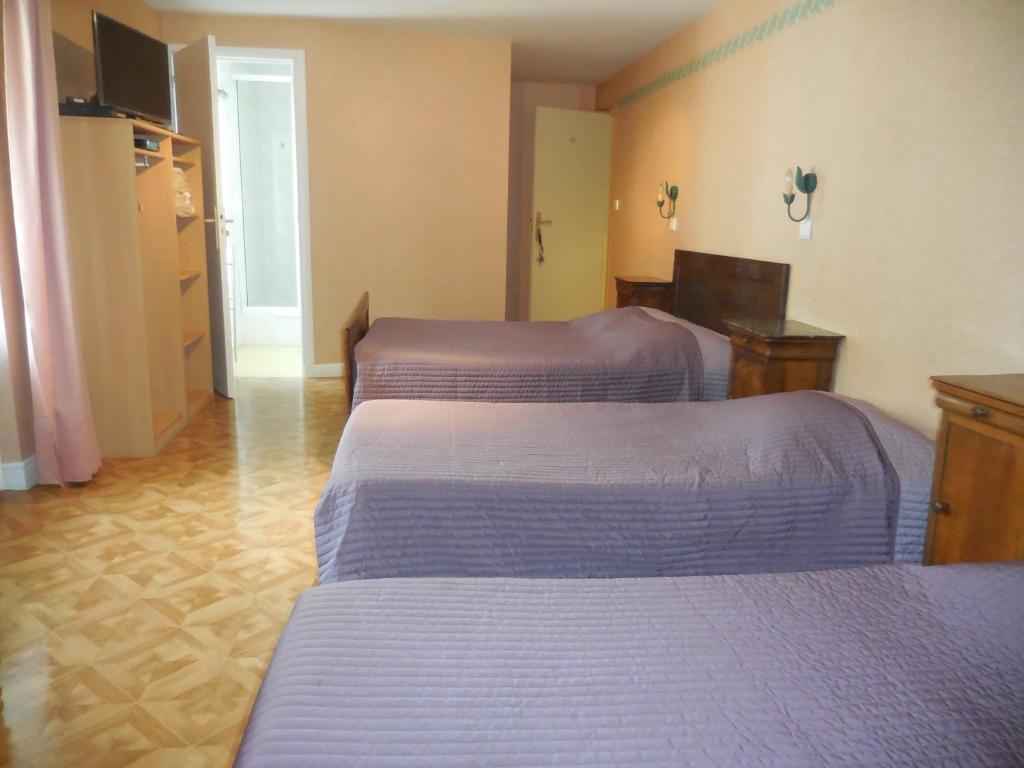 Postel nebo postele na pokoji v ubytování Hotel Magne