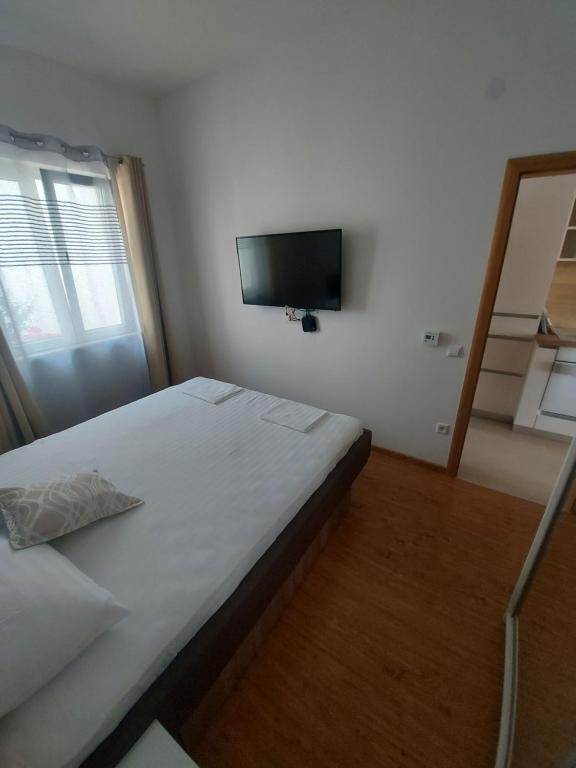 Postel nebo postele na pokoji v ubytování Apartmani Barka
