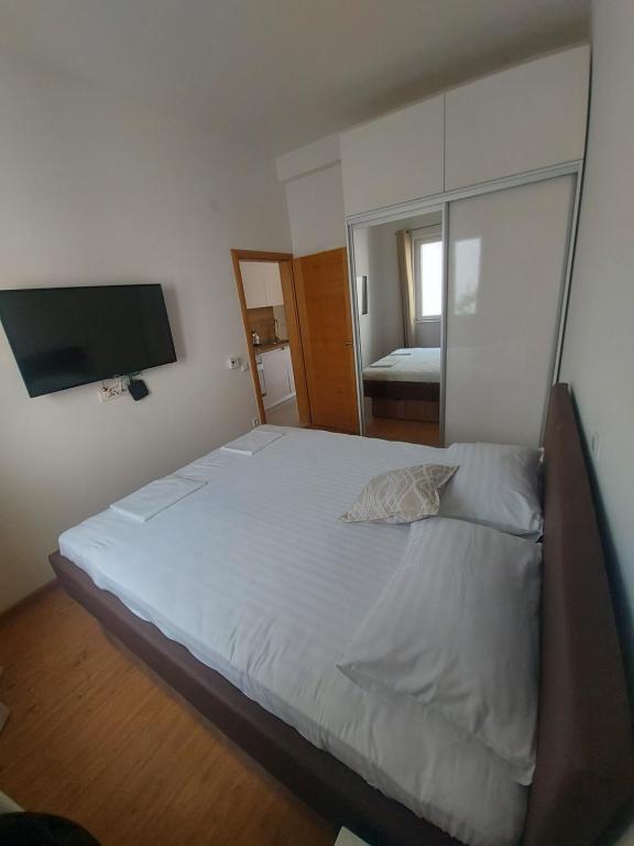 Postel nebo postele na pokoji v ubytování Apartmani Barka