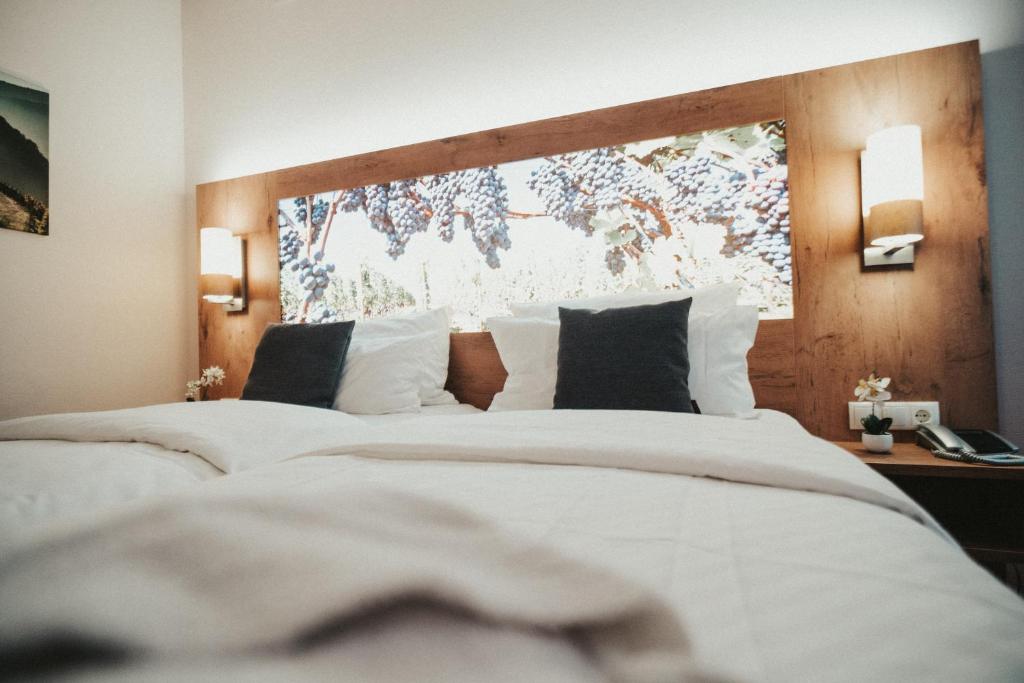 מיטה או מיטות בחדר ב-Hotel Rodderhof