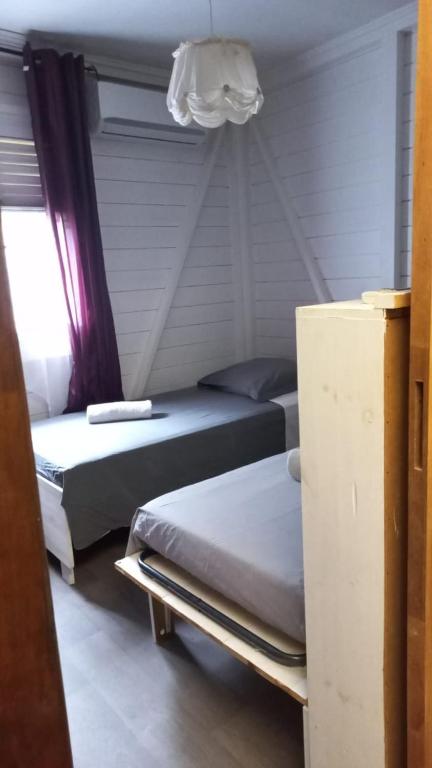 Postel nebo postele na pokoji v ubytování Cap Martinique