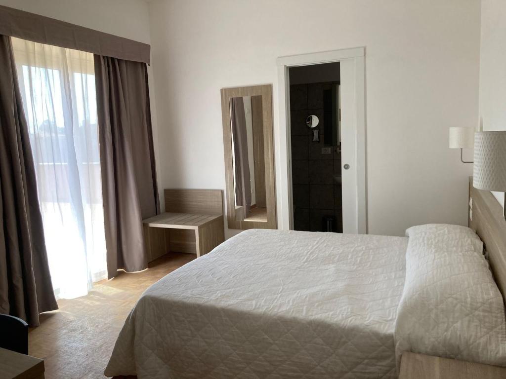 Postel nebo postele na pokoji v ubytování Hotel Nova Domus Aurelia