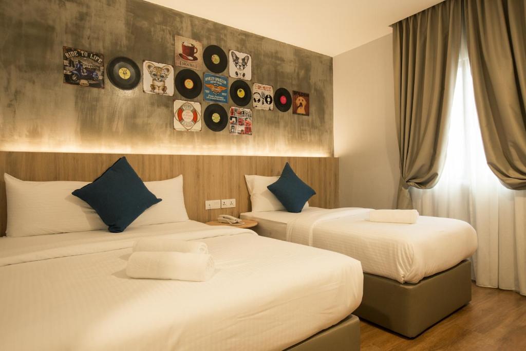 Cama o camas de una habitación en HOTEL CIQ, JALAN TRUS