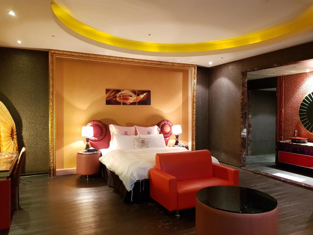 Postel nebo postele na pokoji v ubytování Discovery Motel - Zhonghe