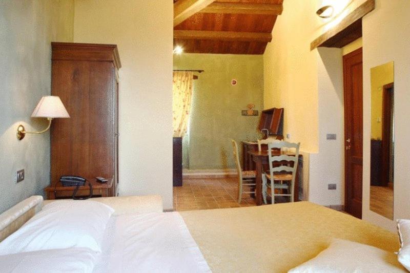 Postel nebo postele na pokoji v ubytování Residence Borgo Da Mare