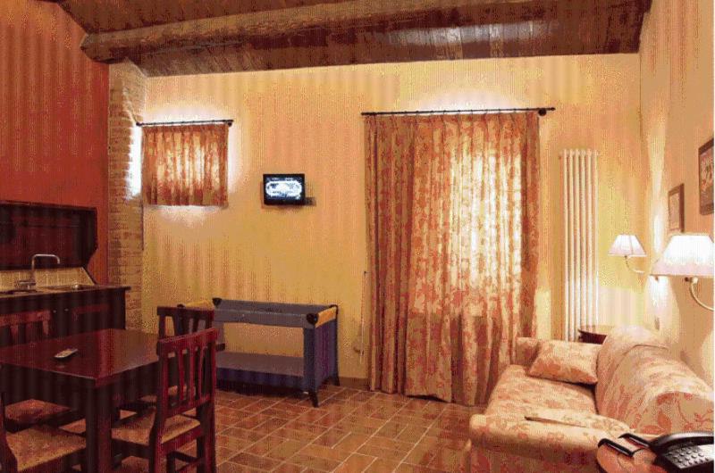 TV a/nebo společenská místnost v ubytování Residence Borgo Da Mare