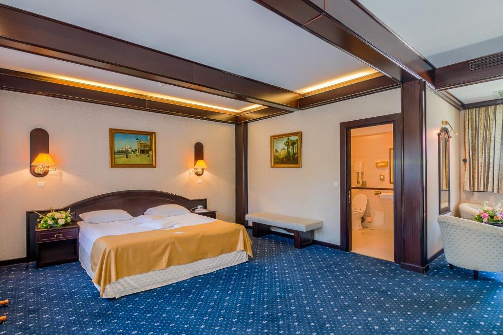 Postel nebo postele na pokoji v ubytování Hotel Snagov Club