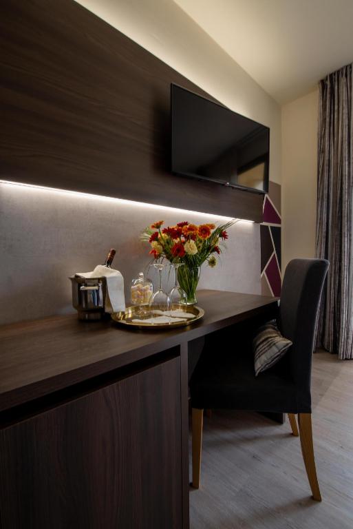 TV a/nebo společenská místnost v ubytování Hotel Carignano