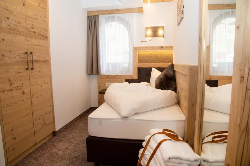 Posteľ alebo postele v izbe v ubytovaní Hotel Victoria