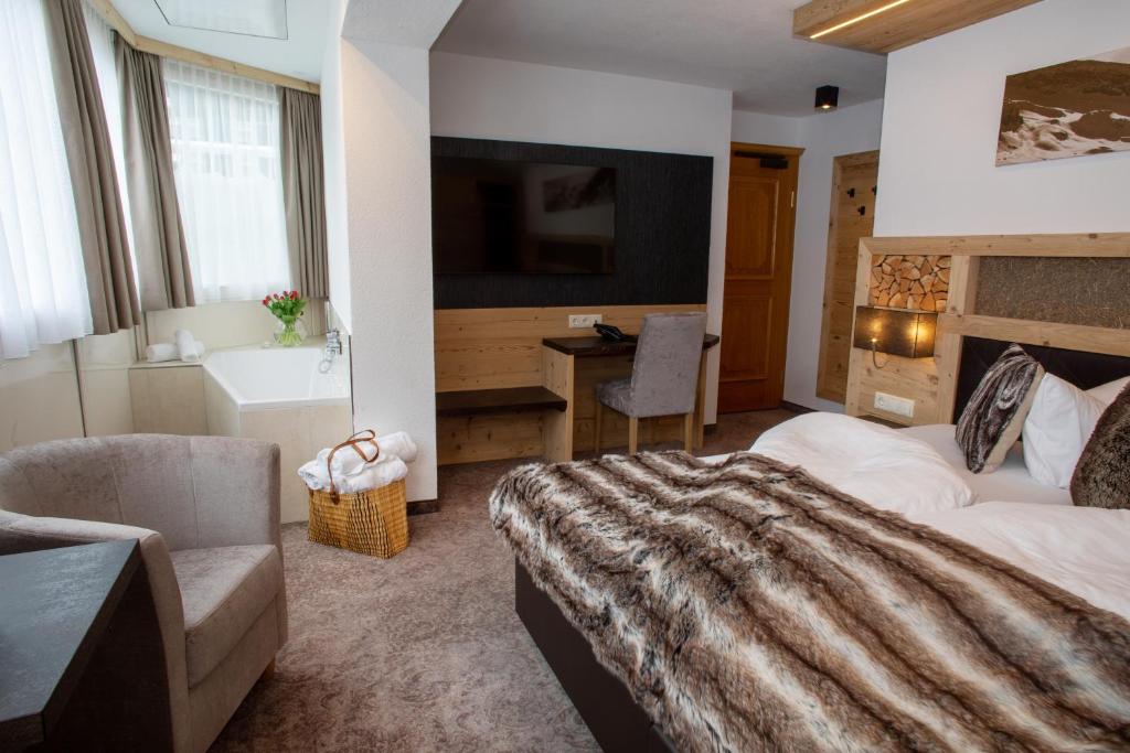 Posteľ alebo postele v izbe v ubytovaní Hotel Victoria