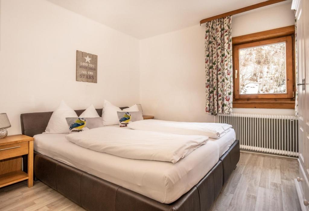 Posteľ alebo postele v izbe v ubytovaní Haus Standlgut Rauris -- incl Sommercard
