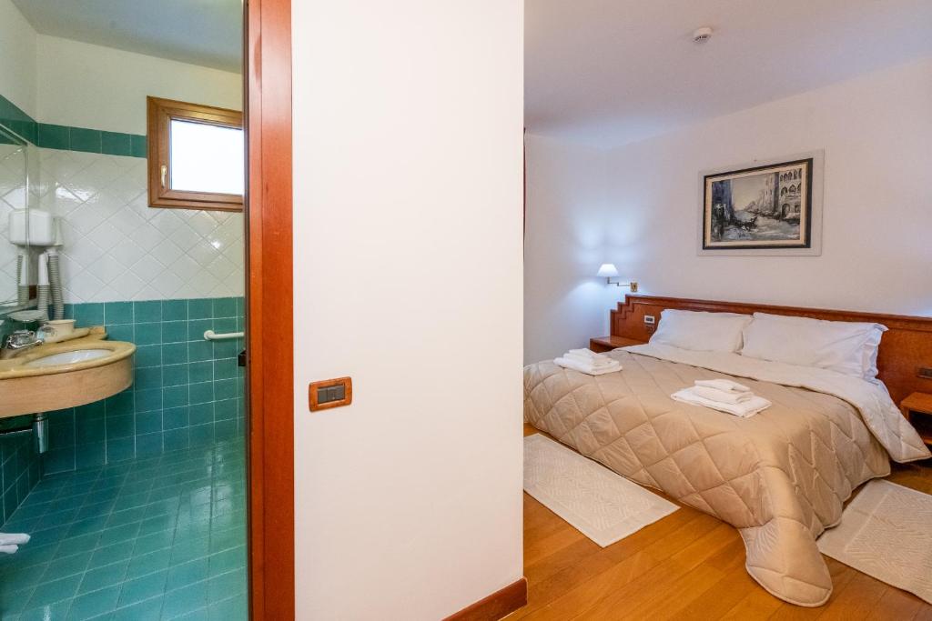 Postel nebo postele na pokoji v ubytování Hotel Fuori Città