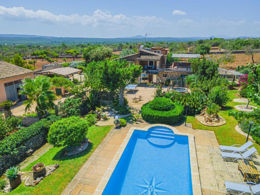 an aerial view of a yard with a swimming pool at Villa Son Fullos in Santa Margalida