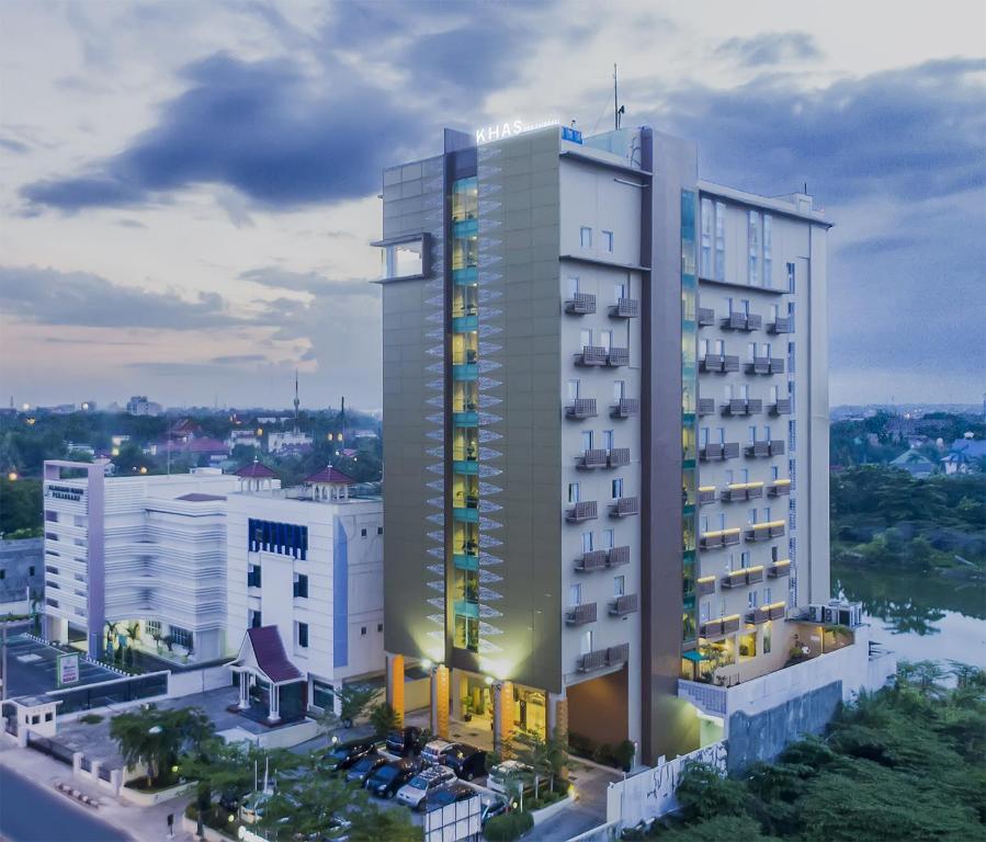 a rendering of a hotel building in a city at KHAS Pekanbaru Hotel in Pekanbaru