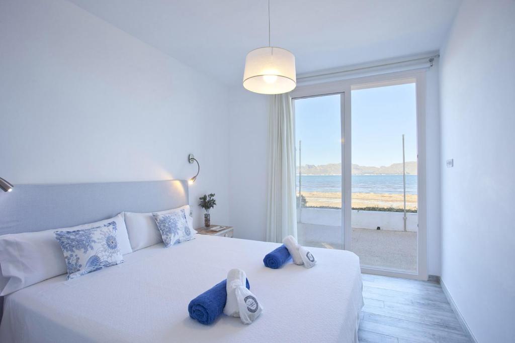 A bed or beds in a room at Ran de mar