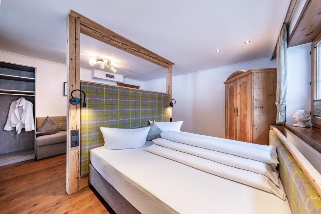 Postel nebo postele na pokoji v ubytování Landhaus Seiringer Apartments
