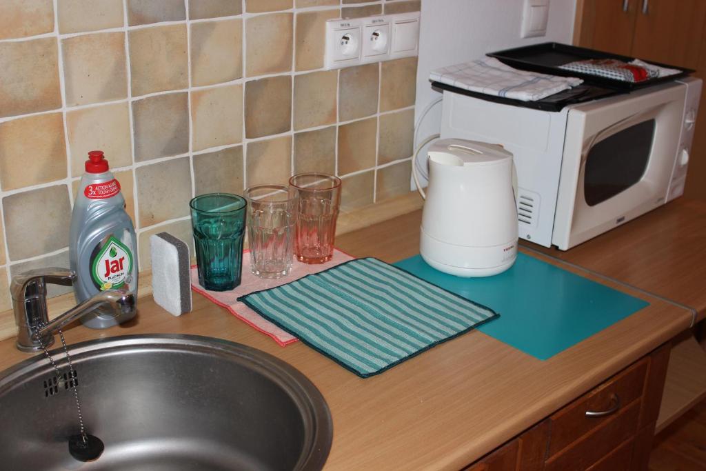 Kuchyňa alebo kuchynka v ubytovaní Zaži Apartmány Fatrapark Hrabovo