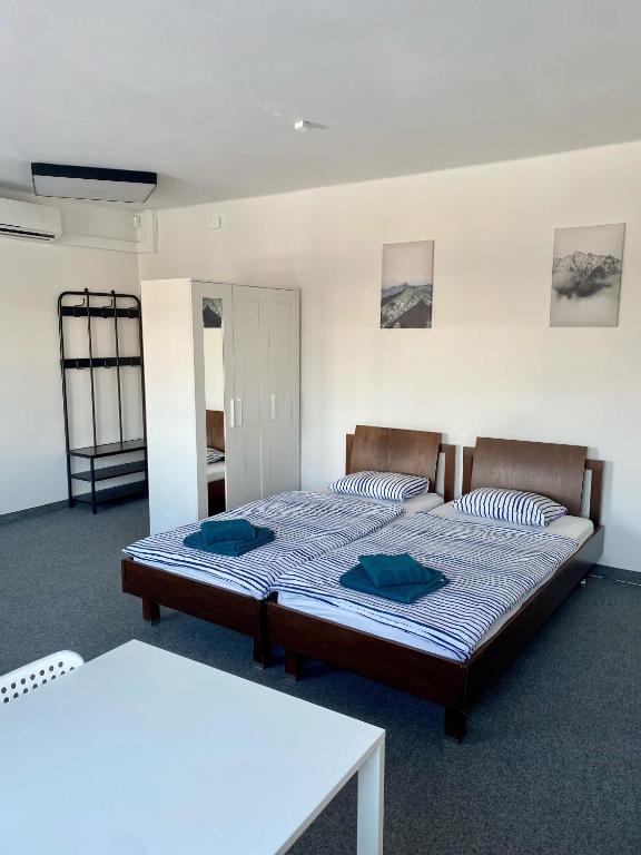 Posteľ alebo postele v izbe v ubytovaní Astra Katowice - Aparthotel