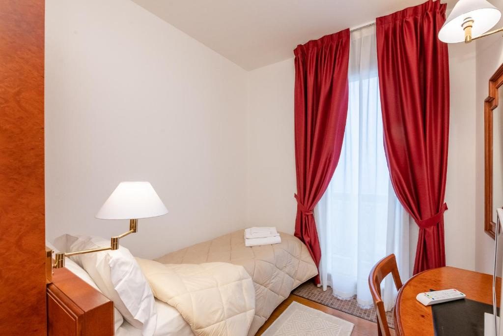 Postel nebo postele na pokoji v ubytování Hotel Fuori Città