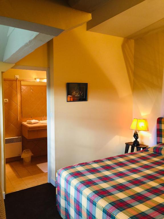 Postel nebo postele na pokoji v ubytování Château Maucaillou