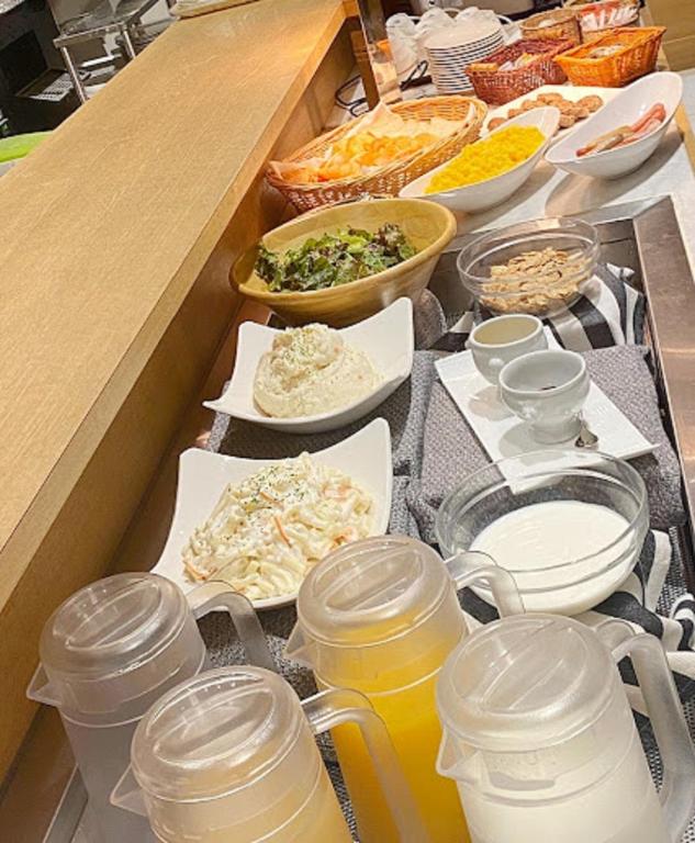a buffet with many different types of food and drinks at Hotel Rose Garden Shinjuku in Tokyo