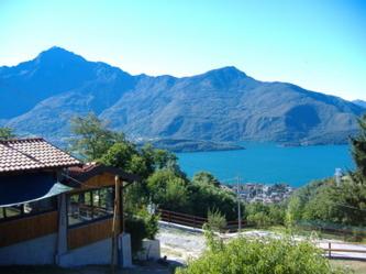 a house with a view of a lake and mountains at Agriturismo Runchee in Vercana