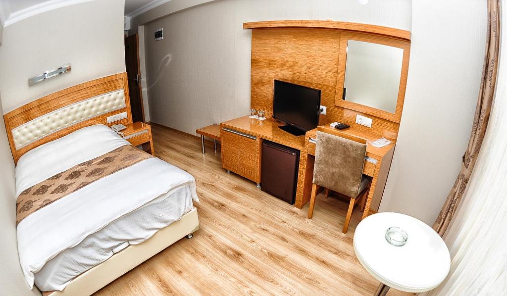 Postel nebo postele na pokoji v ubytování Serenti Pamuk Hotel
