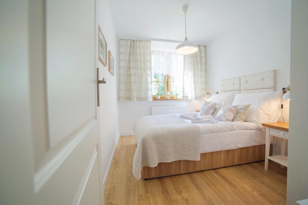 Posteľ alebo postele v izbe v ubytovaní Apartamenty EverySky - Osiedle Podgórze 1E